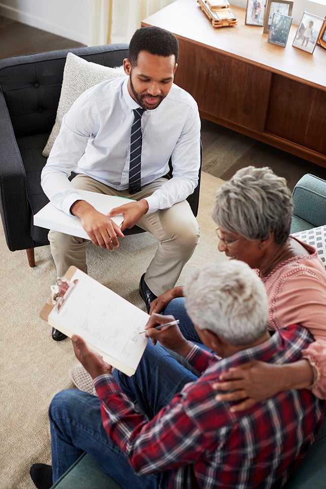 American Pace employee assisting an elderly community member